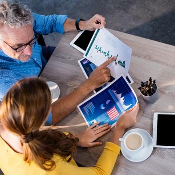 Man and woman looking at information packs